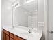 Bright bathroom with a double sink vanity, large mirror, updated fixtures and a tub at 540 Ridge View Xing, Woodstock, GA 30188