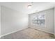 Well-lit bedroom featuring a large window and neutral décor at 540 Ridge View Xing, Woodstock, GA 30188
