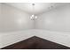 Elegant dining room with hardwood floors, wainscoting, and a chandelier at 540 Ridge View Xing, Woodstock, GA 30188