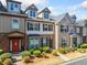A row of well-kept townhomes featuring manicured landscaping and welcoming front entrances at 540 Ridge View Xing, Woodstock, GA 30188