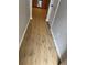 Hallway featuring wood floors and neutral walls providing an updated, modern appeal at 540 Ridge View Xing, Woodstock, GA 30188