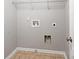 An unfinished laundry room with hookups and a shelf is ready for your washer and dryer at 540 Ridge View Xing, Woodstock, GA 30188