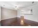 Open-concept living area featuring hardwood floors and a pass-through to another room at 540 Ridge View Xing, Woodstock, GA 30188