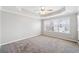 Bright main bedroom featuring neutral walls, a ceiling fan and a large window at 540 Ridge View Xing, Woodstock, GA 30188