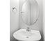 Clean powder room featuring a simple design with a pedestal sink and oval mirror at 540 Ridge View Xing, Woodstock, GA 30188