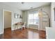 This room has hardwood floors, lots of natural light, neutral walls, and access to a closet at 7104 Woodland Ln, Alpharetta, GA 30009