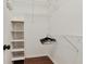 Organized closet with shelving and hanging space for efficient storage at 7104 Woodland Ln, Alpharetta, GA 30009