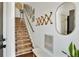 Cozy staircase with carpeted steps, complemented by stylish wall decor and natural light at 7104 Woodland Ln, Alpharetta, GA 30009