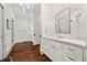 Elegant bathroom featuring white cabinetry, marble countertops, and stylish fixtures at 406 Whitmore Nw Dr, Atlanta, GA 30305