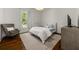 Cozy bedroom with neutral tones, hardwood floors, and natural light at 406 Whitmore Nw Dr, Atlanta, GA 30305