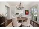 Elegant dining room with a chandelier, hardwood floors, and seating for four at 406 Whitmore Nw Dr, Atlanta, GA 30305