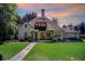 Beautiful home featuring a well-maintained lawn and mature landscaping around the house at 406 Whitmore Nw Dr, Atlanta, GA 30305