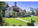 Beautiful home featuring a well-maintained lawn and mature landscaping around the house at 406 Whitmore Nw Dr, Atlanta, GA 30305