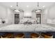Bright kitchen featuring a large center island with a marble countertop and modern lighting at 406 Whitmore Nw Dr, Atlanta, GA 30305