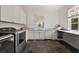 Functional laundry room with sink, cabinetry, counter space, and washer-dryer at 406 Whitmore Nw Dr, Atlanta, GA 30305