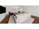 Spacious living room with hardwood floors, a comfortable sectional sofa, and modern decor at 406 Whitmore Nw Dr, Atlanta, GA 30305