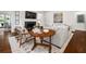 Bright living room with fireplace, hardwood floors, and comfortable seating at 406 Whitmore Nw Dr, Atlanta, GA 30305
