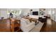 Cozy living room with built-in shelves, a large sofa, and warm, inviting decor at 406 Whitmore Nw Dr, Atlanta, GA 30305