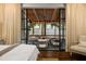 View from bedroom highlighting a covered patio with comfortable seating area at 406 Whitmore Nw Dr, Atlanta, GA 30305