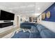 Finished basement featuring modern lighting, wainscoting, and a large entertainment center at 4630 Smokestone Dr, Douglasville, GA 30135