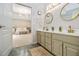 Bright bathroom featuring a double sink vanity and views into the main bedroom at 4630 Smokestone Dr, Douglasville, GA 30135