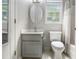 Classic bathroom with a single sink vanity, toilet, and shower-tub combo at 4630 Smokestone Dr, Douglasville, GA 30135
