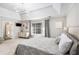 Bright bedroom with a large window, neutral walls, and a bed with a patterned quilt at 4630 Smokestone Dr, Douglasville, GA 30135