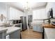 Modern kitchen featuring stainless steel appliances, sleek countertops, and ample cabinet space at 4630 Smokestone Dr, Douglasville, GA 30135