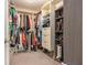 Well-organized walk-in closet with custom shelving, hanging rods, and ample storage space for clothing and shoes at 4630 Smokestone Dr, Douglasville, GA 30135