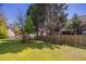 Serene backyard with green lawn, trees, and privacy fence, ideal for relaxation and outdoor fun at 1602 Allsworth Se Ct, Smyrna, GA 30082