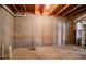 Unfinished basement featuring concrete flooring and walls and utilities at 1602 Allsworth Se Ct, Smyrna, GA 30082