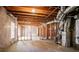 Unfinished basement with stud framing offering customization and the potential for future expansion and storage at 1602 Allsworth Se Ct, Smyrna, GA 30082