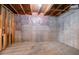 Unfinished basement with concrete walls, exposed ceiling and floor, and exposed ceiling joists at 1602 Allsworth Se Ct, Smyrna, GA 30082