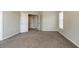 Neutral bedroom with soft carpeting, natural light from the window, and doorway to another room at 1602 Allsworth Se Ct, Smyrna, GA 30082