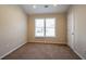 Bedroom featuring carpet, a window with blinds, and neutral wall paint at 1602 Allsworth Se Ct, Smyrna, GA 30082