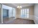 Open dining room features wainscoting, columns, and shuttered windows at 1602 Allsworth Se Ct, Smyrna, GA 30082
