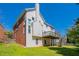 Back of home with a deck perfect for entertaining and enjoying the backyard views with walk down stairs at 1602 Allsworth Se Ct, Smyrna, GA 30082