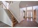 Light foyer with staircase, high ceilings, and beautiful entryway at 1602 Allsworth Se Ct, Smyrna, GA 30082