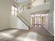Bright foyer features high ceilings and staircase with wood railing at 1602 Allsworth Se Ct, Smyrna, GA 30082