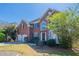 Beautiful brick two-story home featuring manicured lawn and attached two-car garage at 1602 Allsworth Se Ct, Smyrna, GA 30082