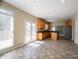 Bright kitchen with tiled floor, wood cabinets, granite countertops, and stainless steel appliances at 1602 Allsworth Se Ct, Smyrna, GA 30082