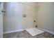 Laundry room with tile flooring and a white basin at 1602 Allsworth Se Ct, Smyrna, GA 30082