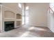 Open living room with fireplace, built-in shelving, and high ceilings at 1602 Allsworth Se Ct, Smyrna, GA 30082