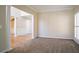 Open living room with neutral walls, carpeted floors, and architectural columns at 1602 Allsworth Se Ct, Smyrna, GA 30082