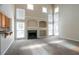Spacious living room boasts a fireplace, built-ins, and large windows at 1602 Allsworth Se Ct, Smyrna, GA 30082