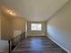 Bright living space with wood-look floors, neutral paint, and a staircase, creating an inviting atmosphere at 2326 Union Grove Ct, Lithonia, GA 30058