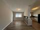 Inviting living area flows into the kitchen, featuring a breakfast bar and providing a seamless entertaining space at 2326 Union Grove Ct, Lithonia, GA 30058