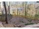 Fenced backyard with wooded view from property at 4955 Day Lily Nw Way, Acworth, GA 30102