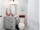 Charming bathroom with a single sink vanity and decorative accents at 4955 Day Lily Nw Way, Acworth, GA 30102