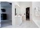 En-suite bathroom featuring a vanity, walk-in closet, and easy access to the main bedroom at 4955 Day Lily Nw Way, Acworth, GA 30102